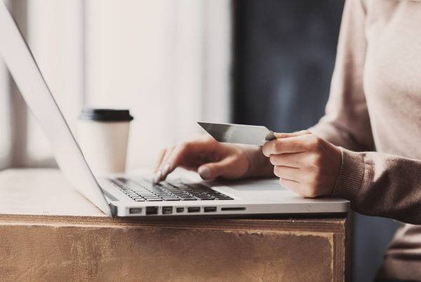 Girl Holding a Bank Card