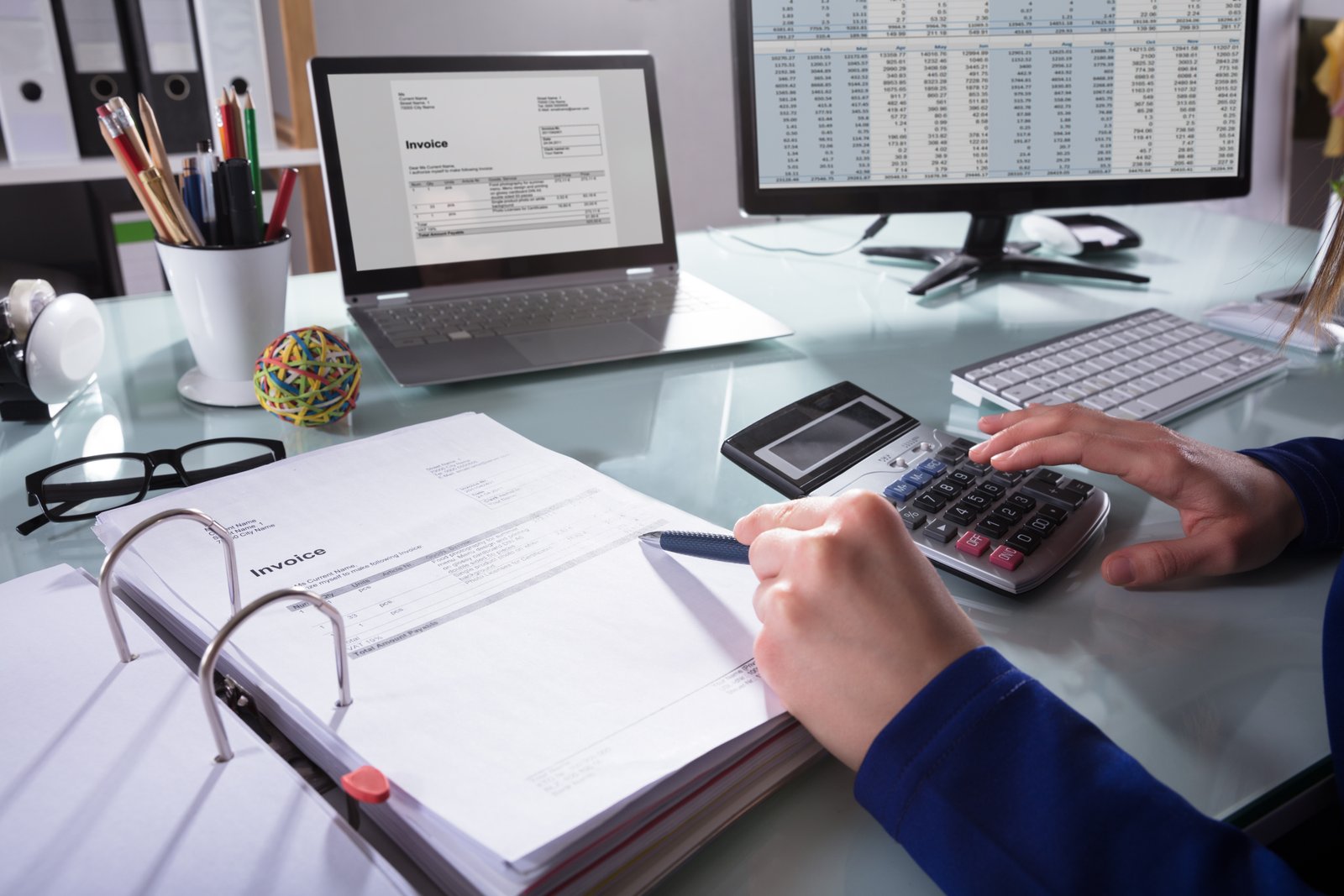 Person Calculating Bills