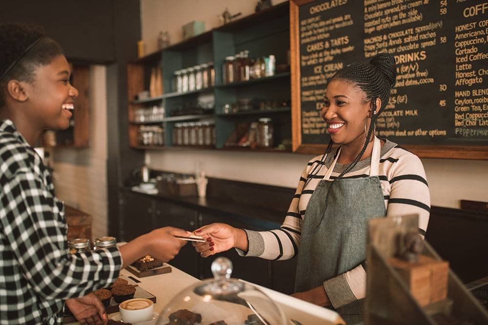 Barista Taking Credit Card From Customer
