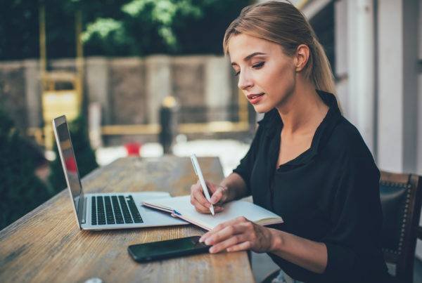 Girl Writing Something on Paper