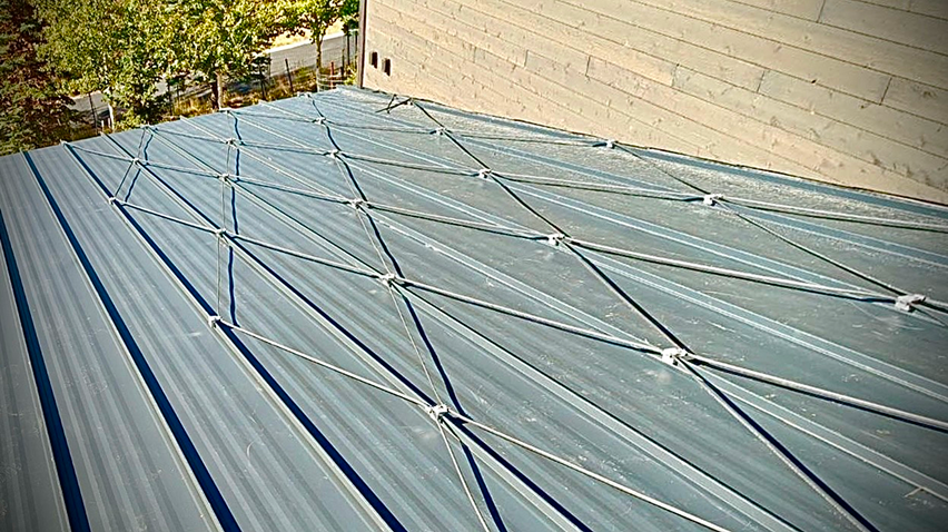 Heat cables installed in a diamond pattern on a metal roof